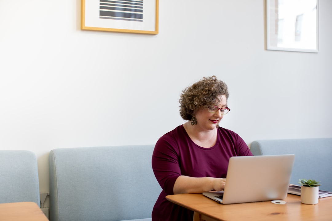 woman working laptop bright office