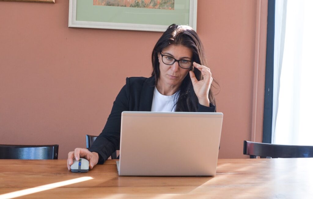 frustrated woman working laptop home desk