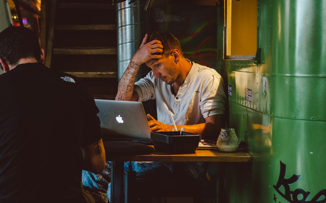 frustrated businessman laptop night