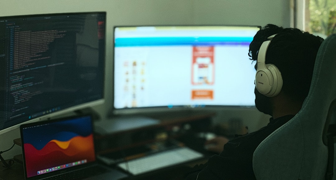 software engineer coding dual monitor