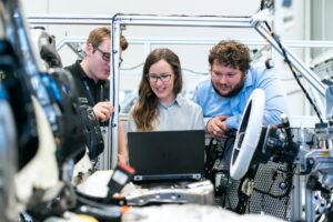 two engineers comparing laptops