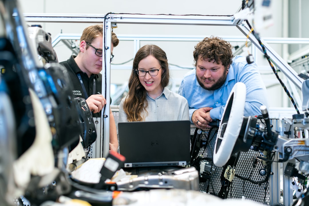 two engineers comparing laptops