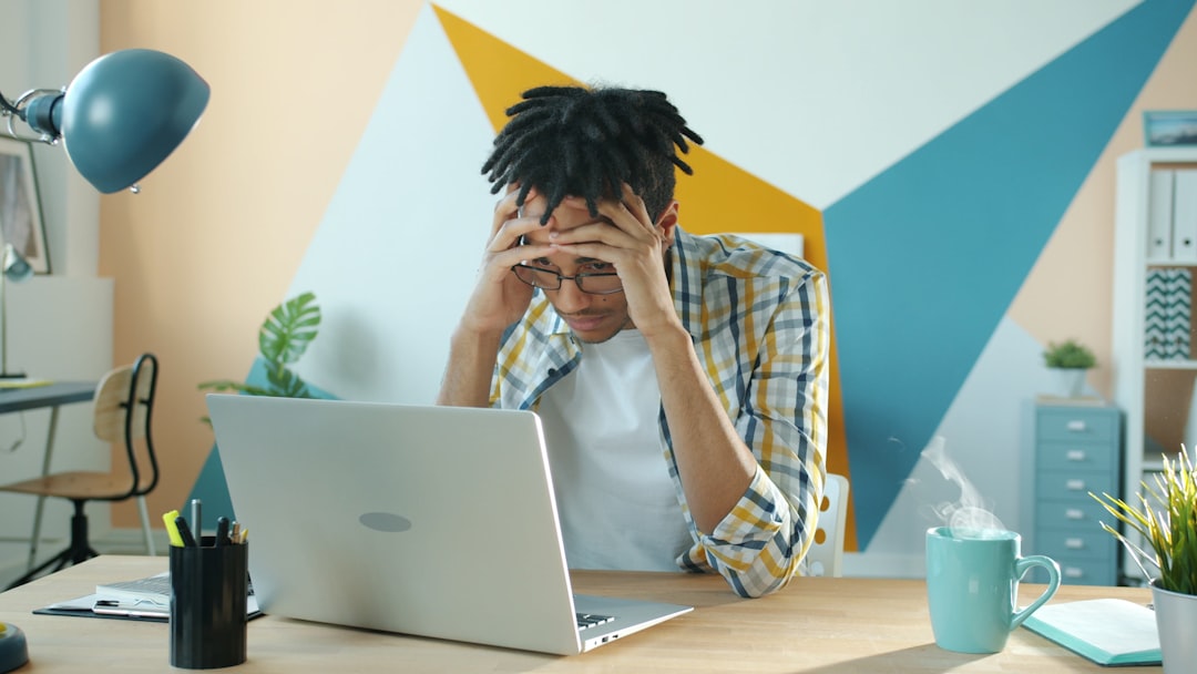 frustrated person looking at laptop screen