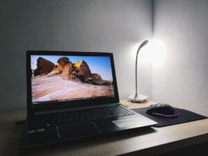 night desk laptop editing video freelance