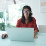 woman working laptop home desk
