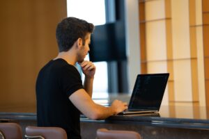 man working laptop presentation slides desk