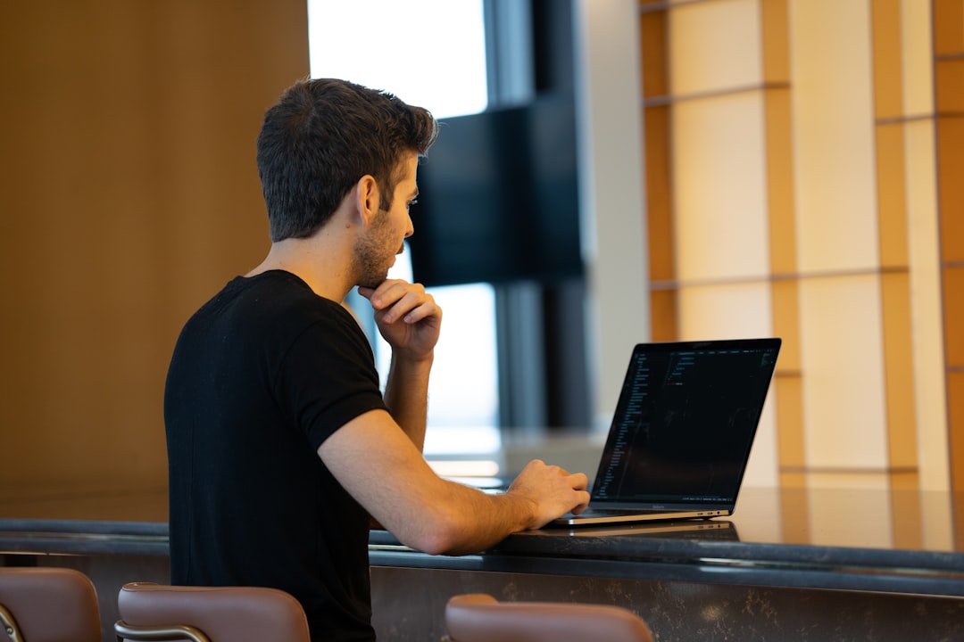 man working laptop presentation slides desk