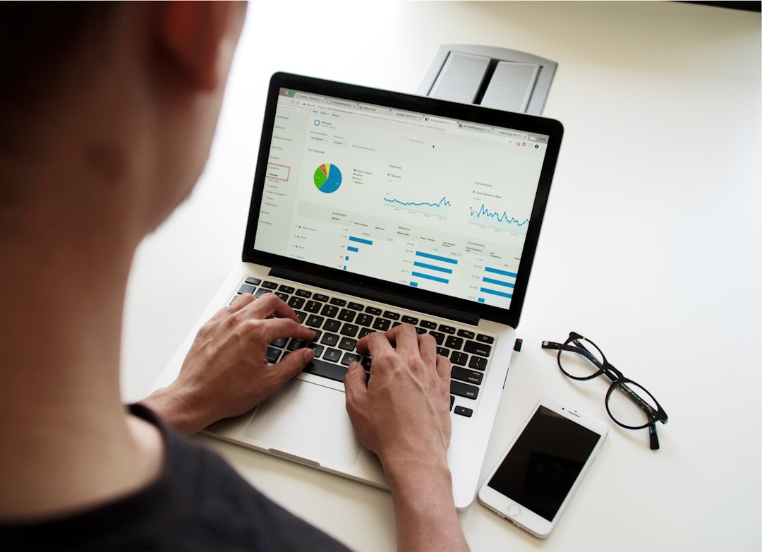 person analyzing spreadsheet data screen