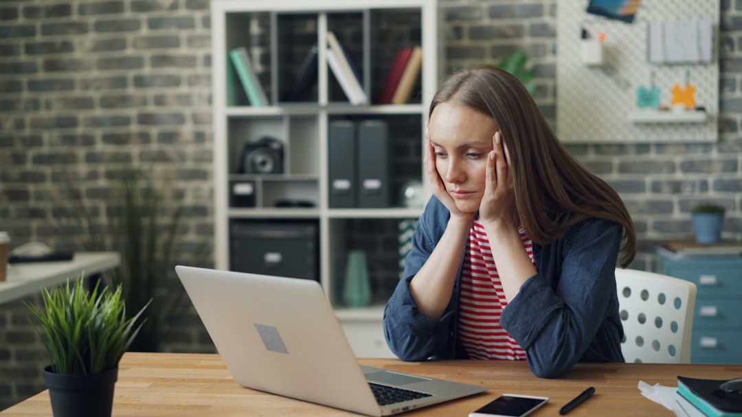 tired woman thinking laptop stress