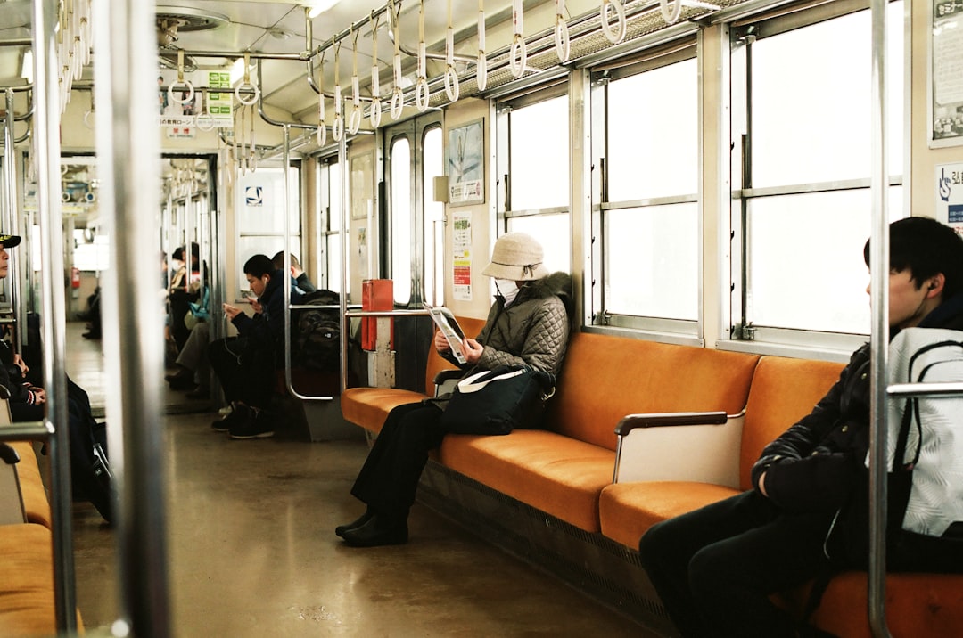 japanese businessman studying on train commute