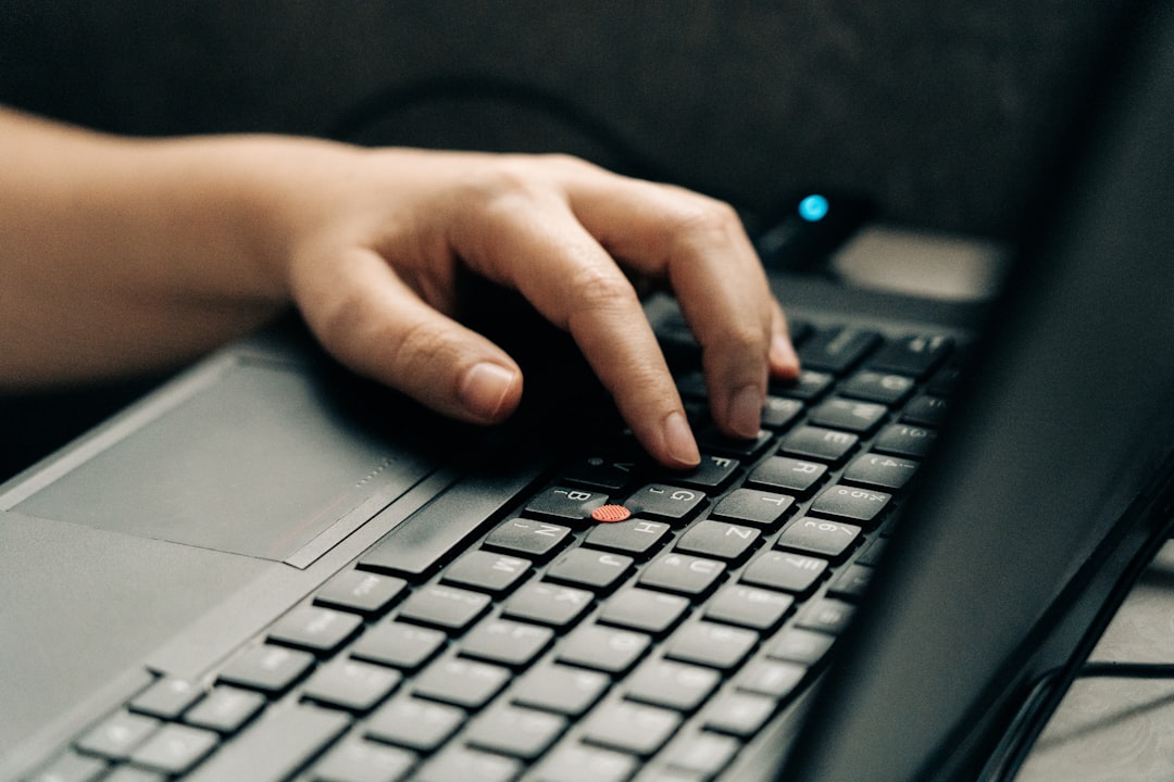 person typing keyboard beginner workspace