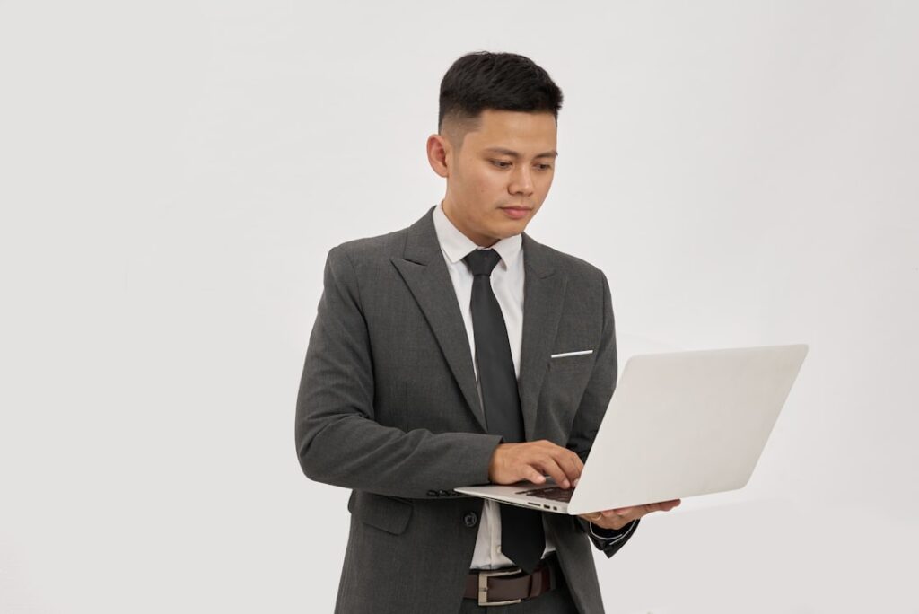 japanese businessman using laptop confident