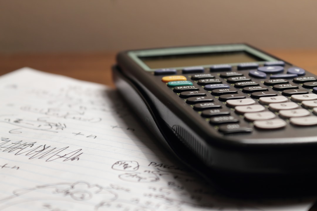 calculator and financial planning documents on desk