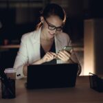 woman studying online course laptop night