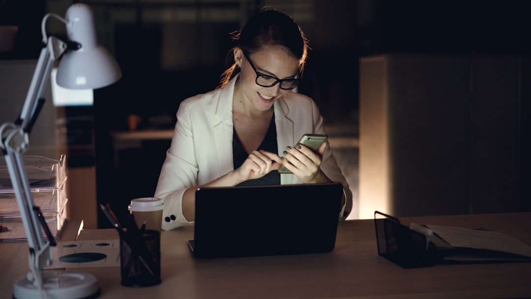 woman studying online course laptop night