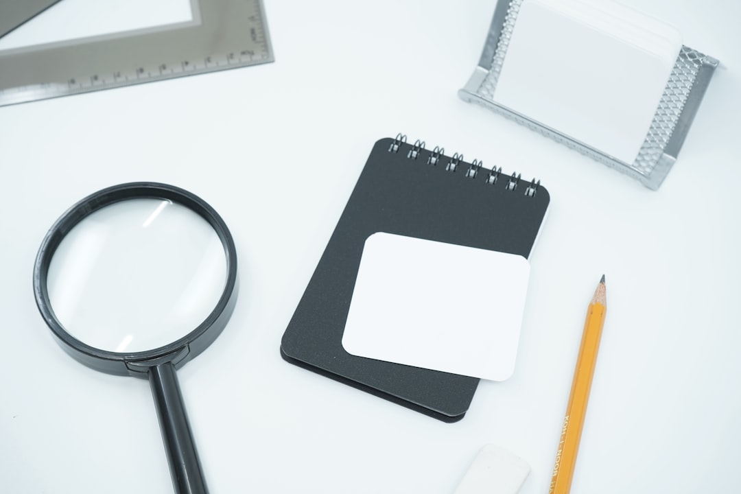 checklist and magnifying glass on desk