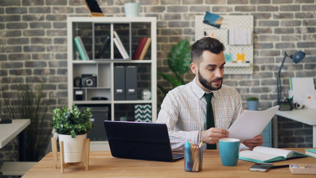 office worker reviewing documents desk