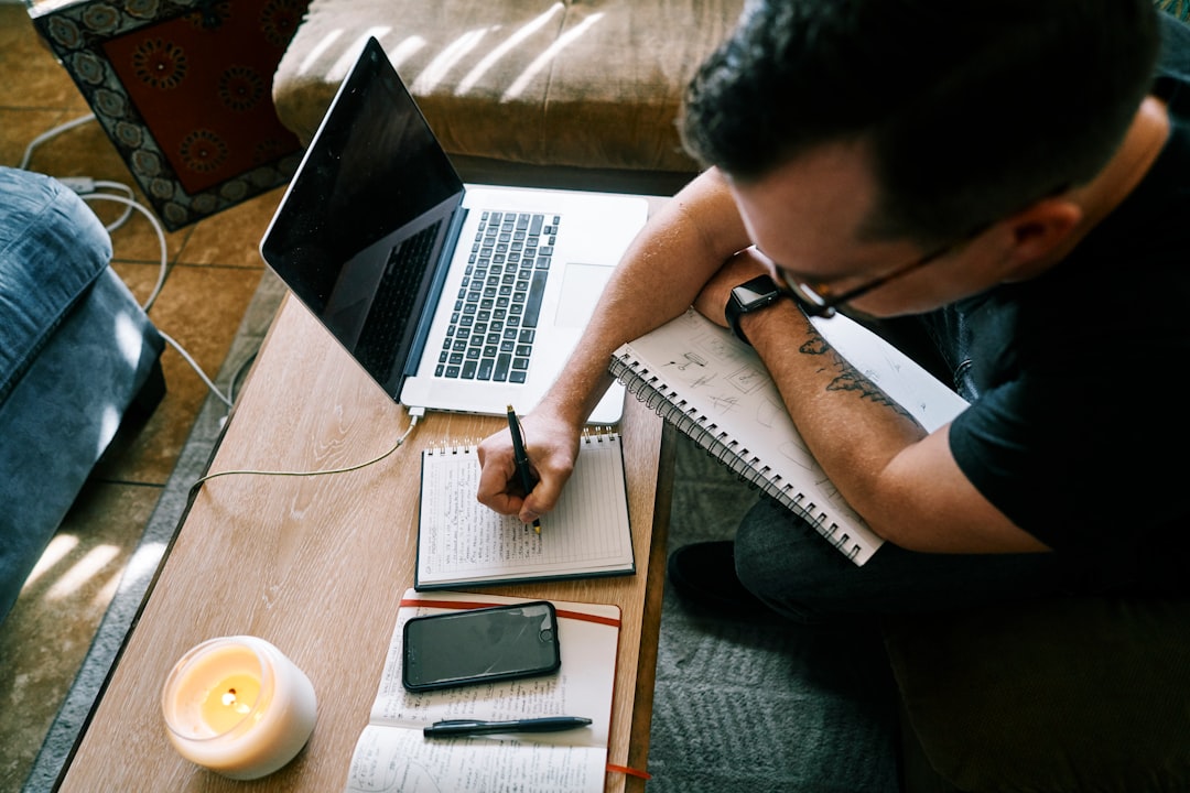 man planning notebook strategy