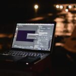 freelance developer working alone at night laptop