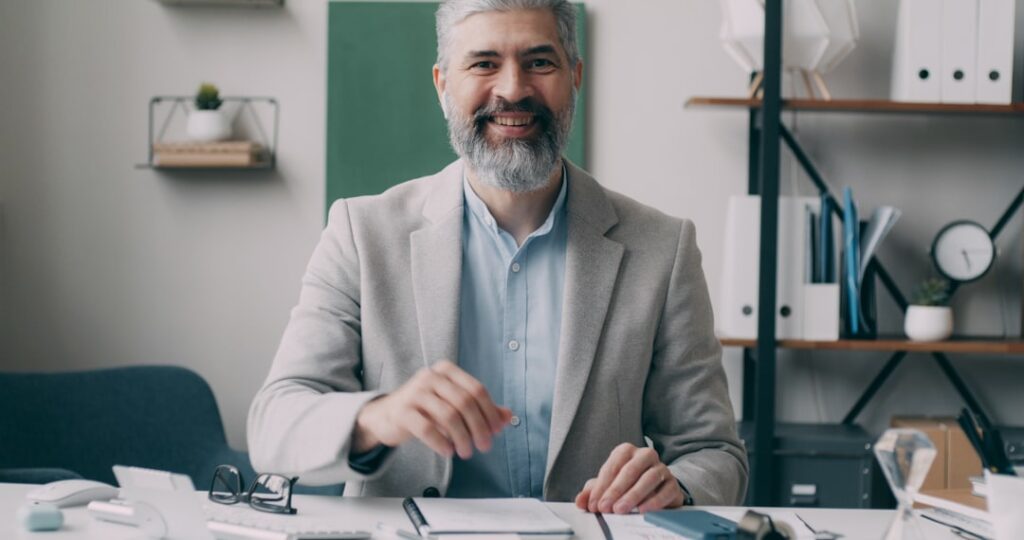 confident middle aged businessman office