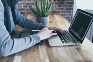 software tester working on laptop
