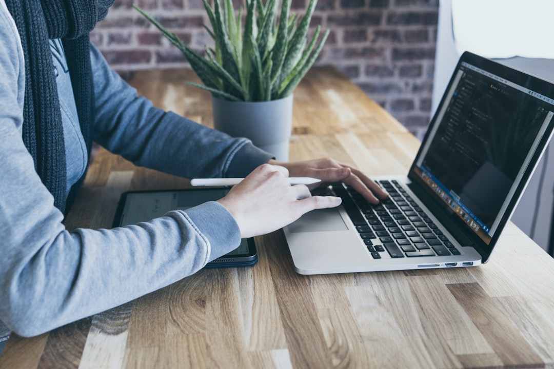 software tester working on laptop