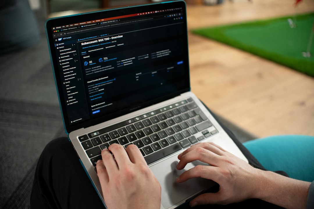 software tester working on laptop