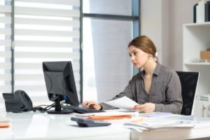 office worker checking documents at desk
