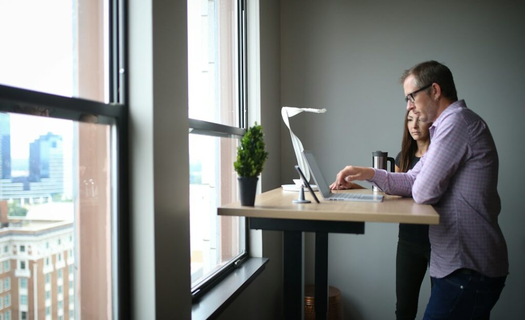 businessman thinking at desk office window