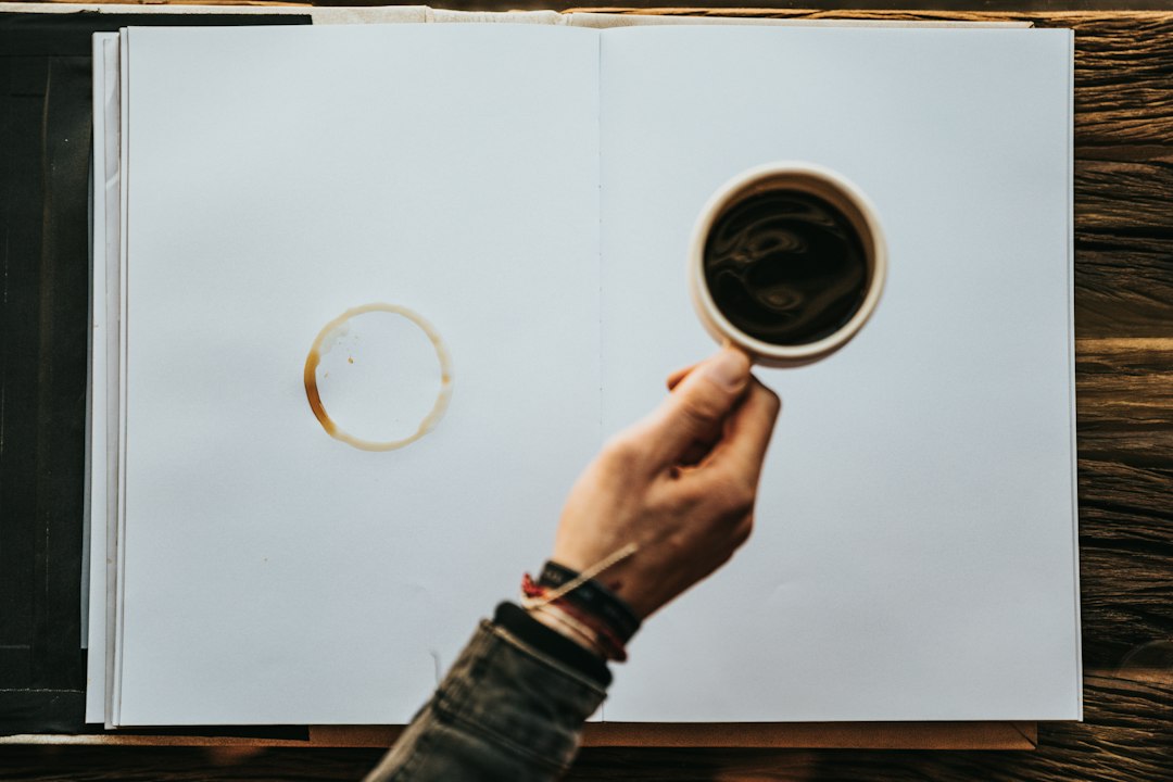 person planning strategy notebook coffee