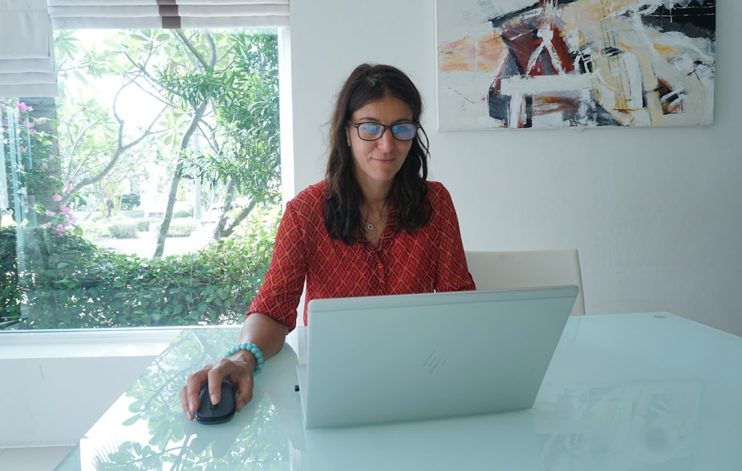 woman working laptop home desk