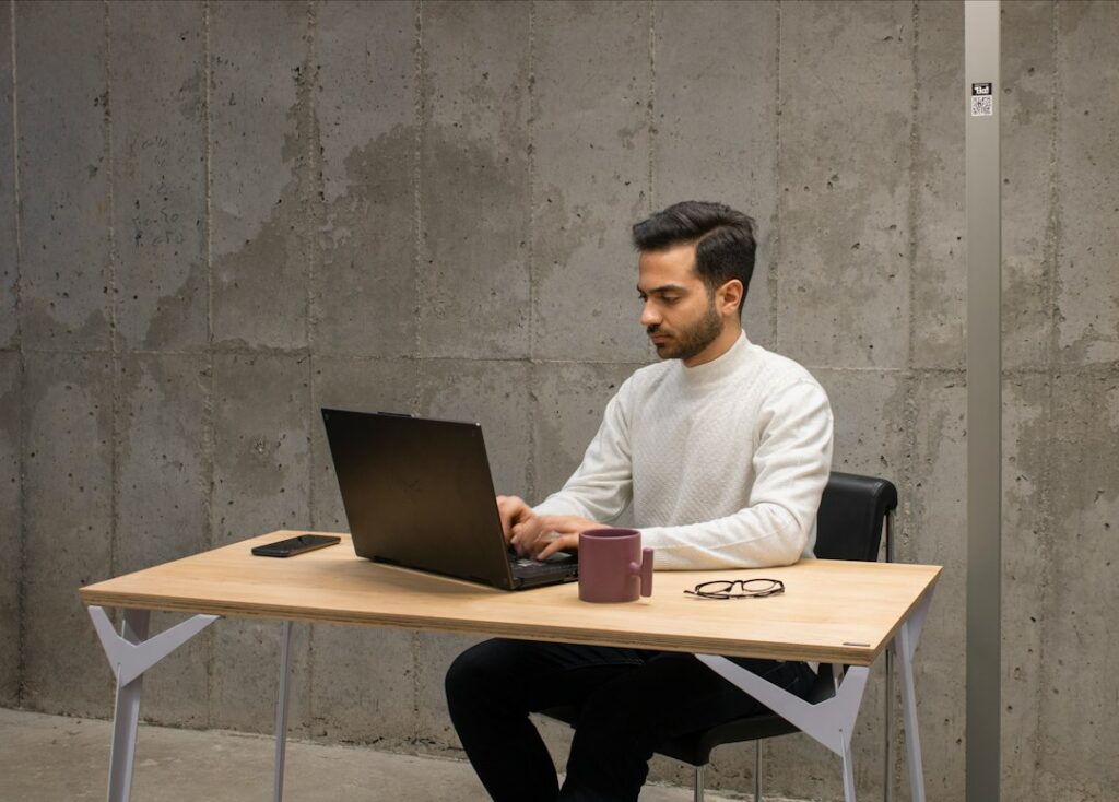 freelance software engineer working laptop office