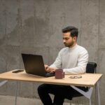 freelance software engineer working laptop office