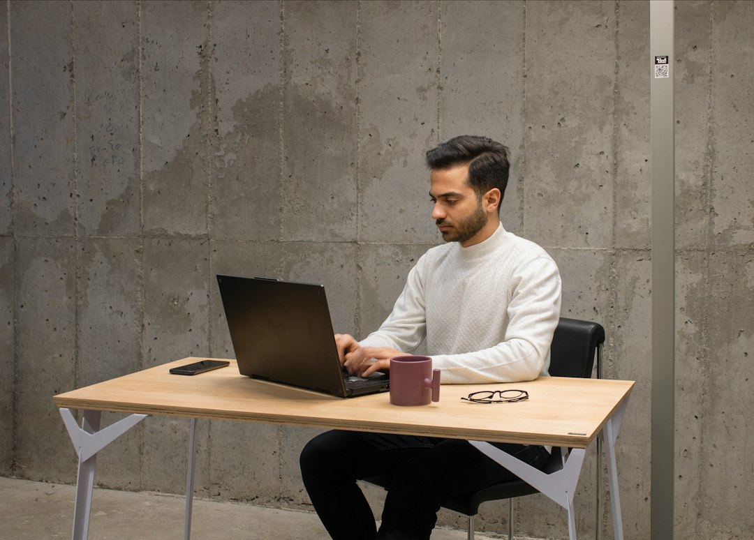 freelance software engineer working laptop office