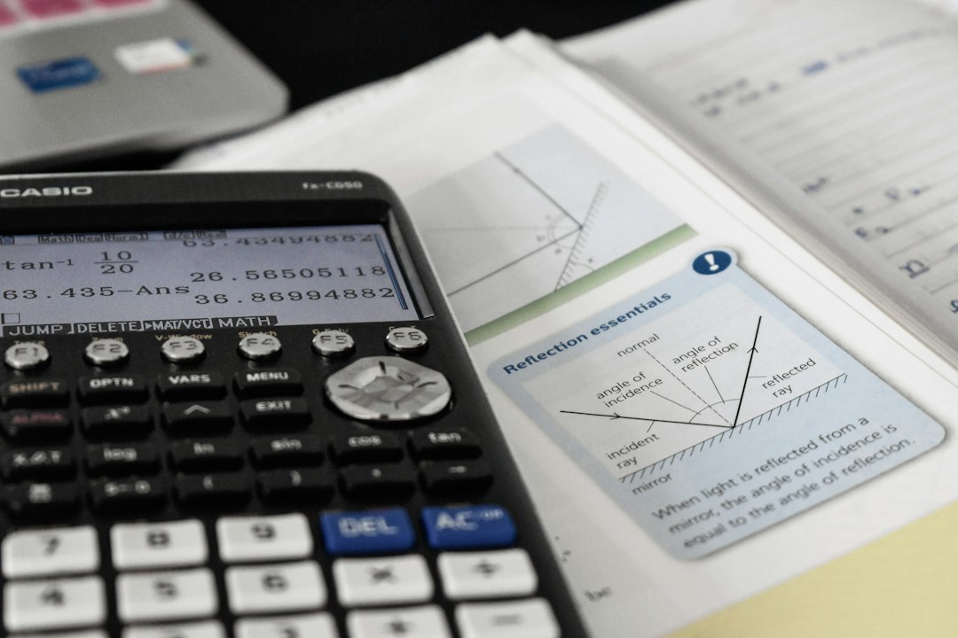 calculator and salary comparison documents on desk