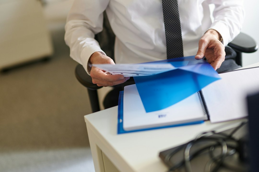 person comparing documents thinking