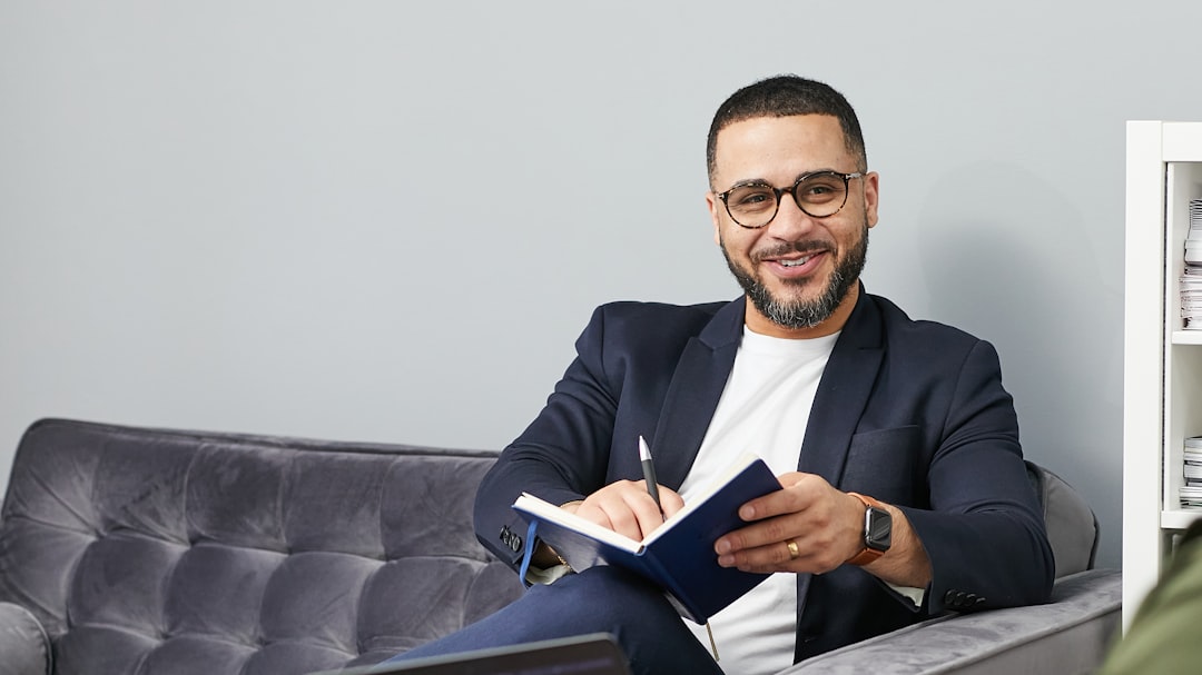 businessman writing career plan notebook