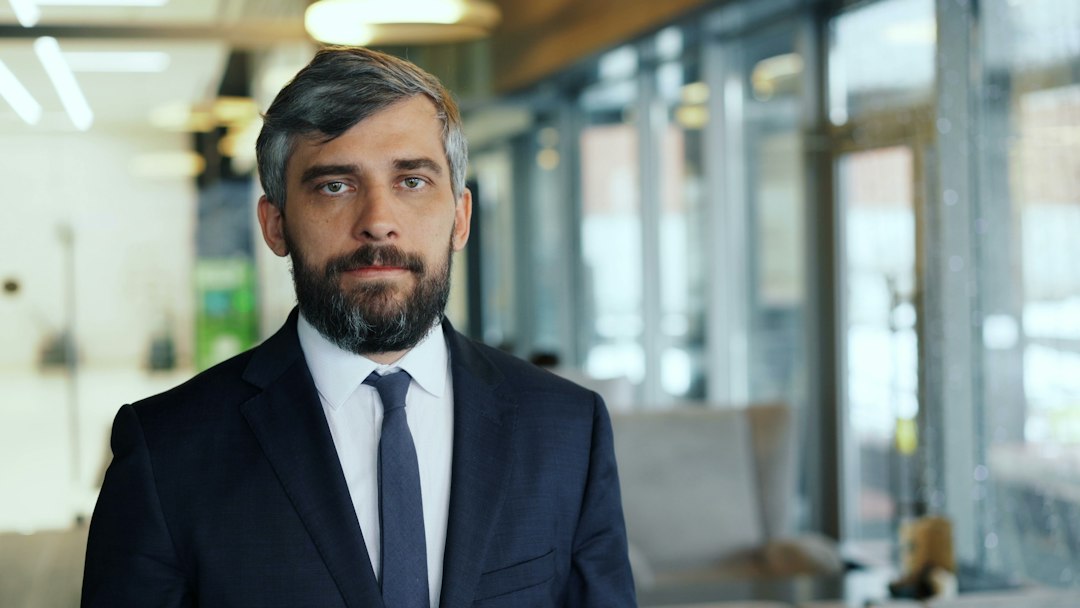 confident middle aged businessman office