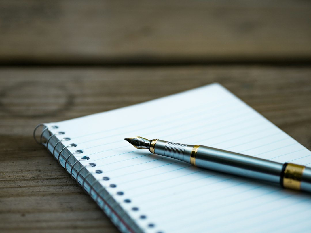 resume writing with pen and notebook