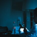 businessman using smartphone at night