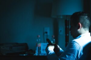 businessman using smartphone at night