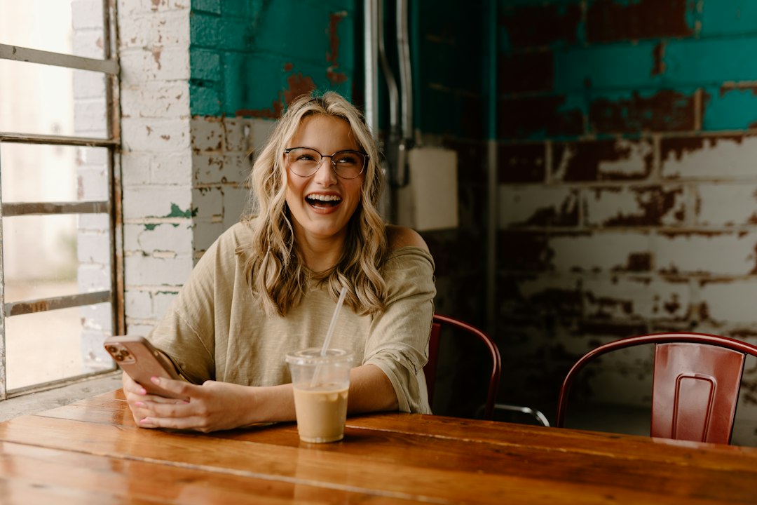 smiling woman relieved coffee shop