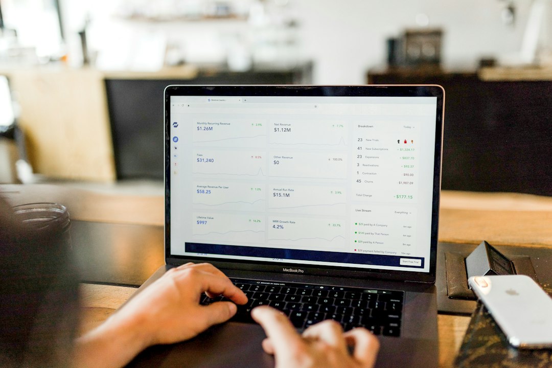 person entering receipts into accounting software laptop