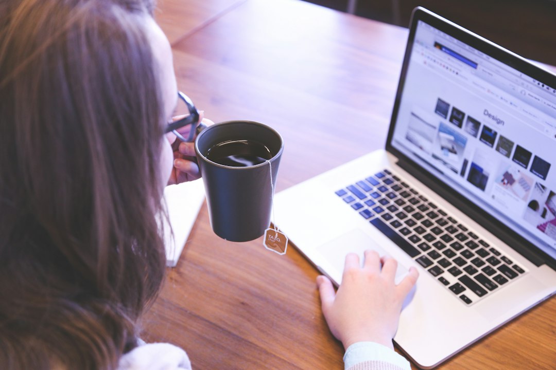 woman comparing options with notebook and coffee