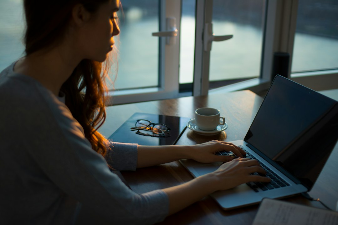 person reviewing household budget on laptop at night