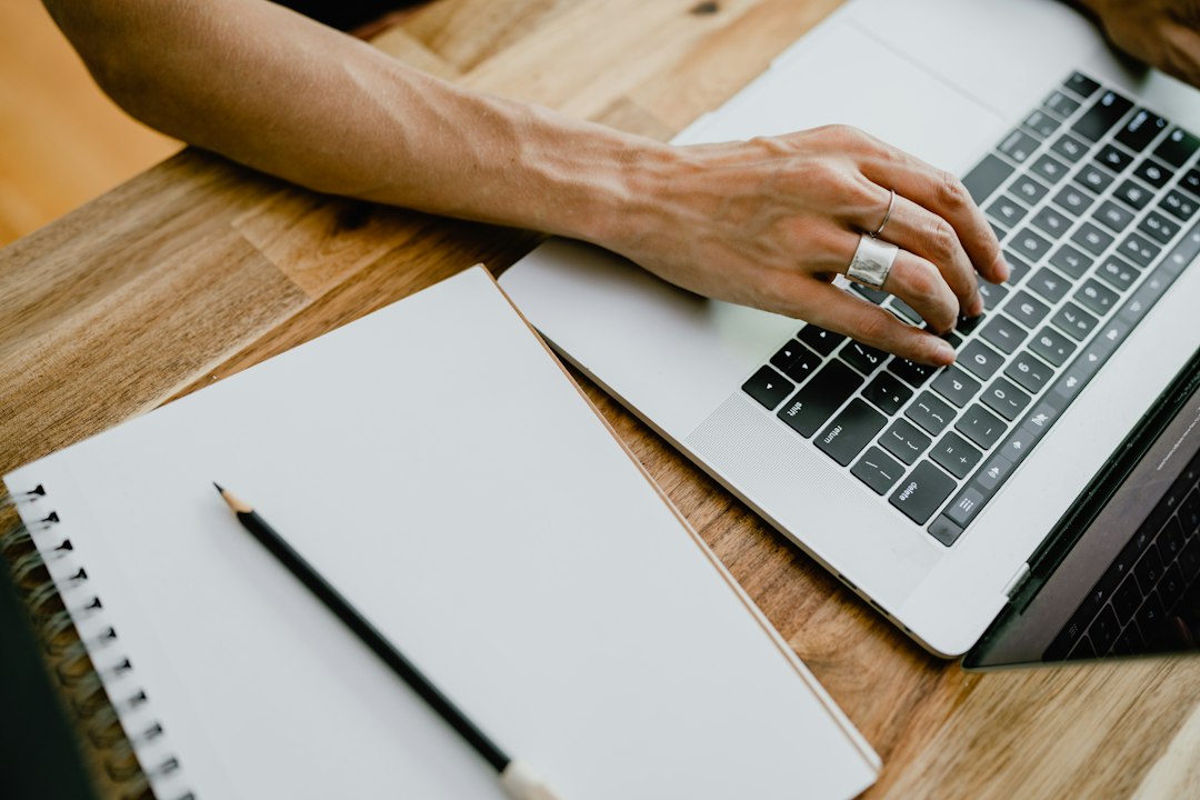freelancer browsing job platform on laptop