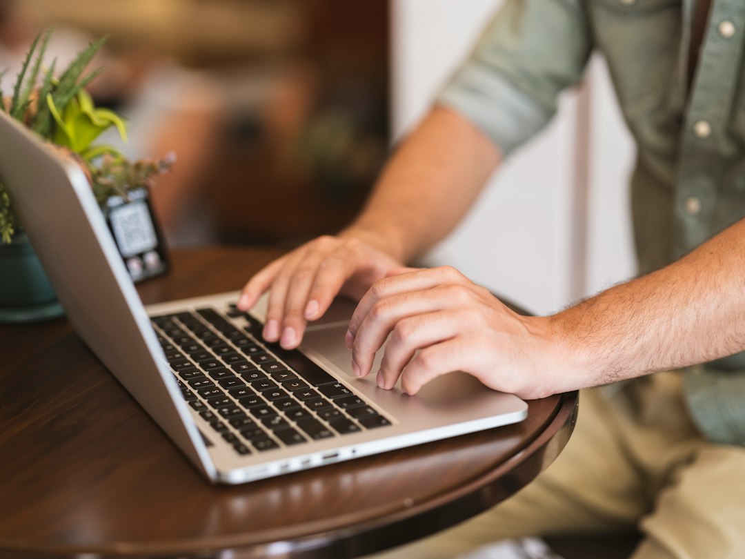 person using laptop job search home