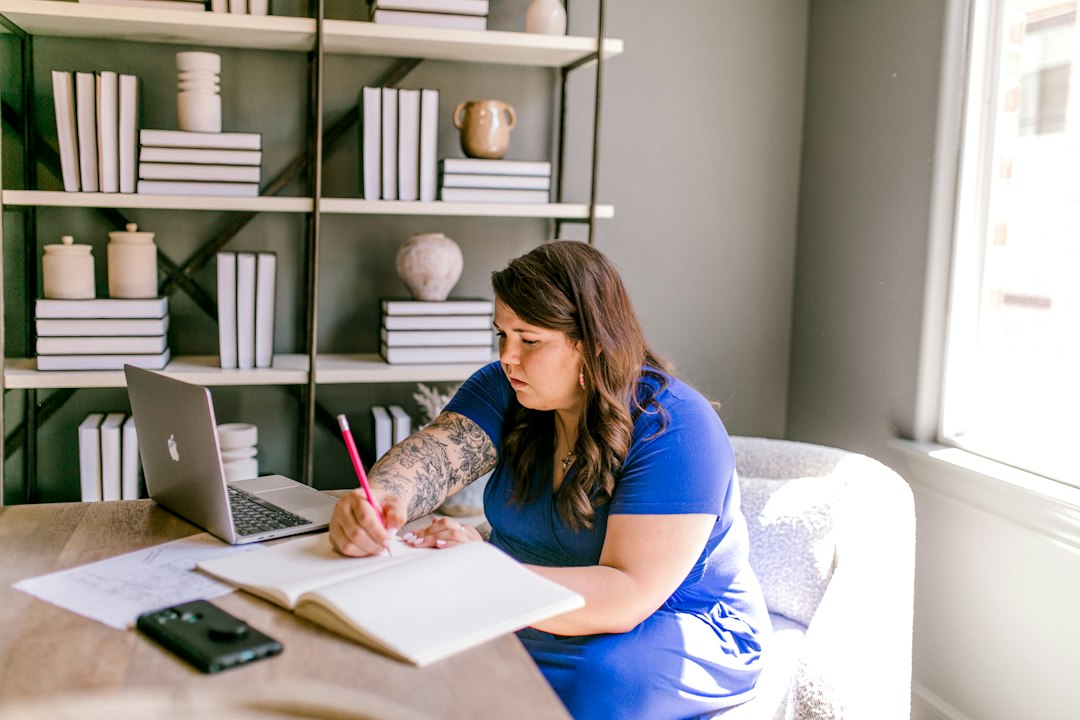 woman studying bookkeeping certificate at home desk